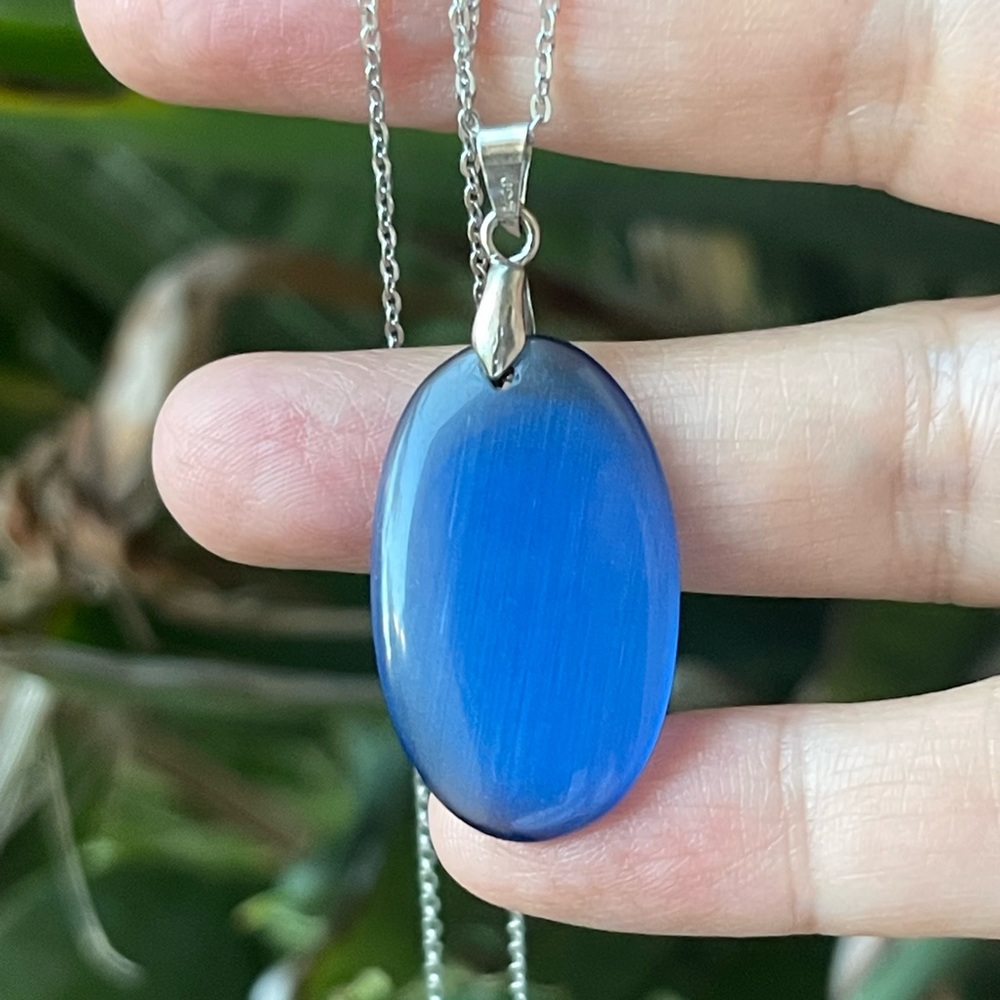 Blue shiny glass pendant and silver tone metal chain